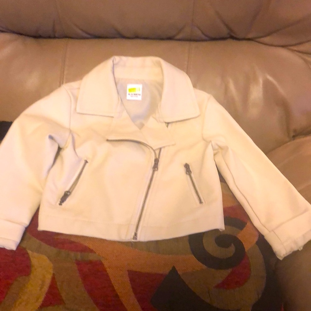 A very stylish leather like toddler’s cream colour jacket, size 18-24 months